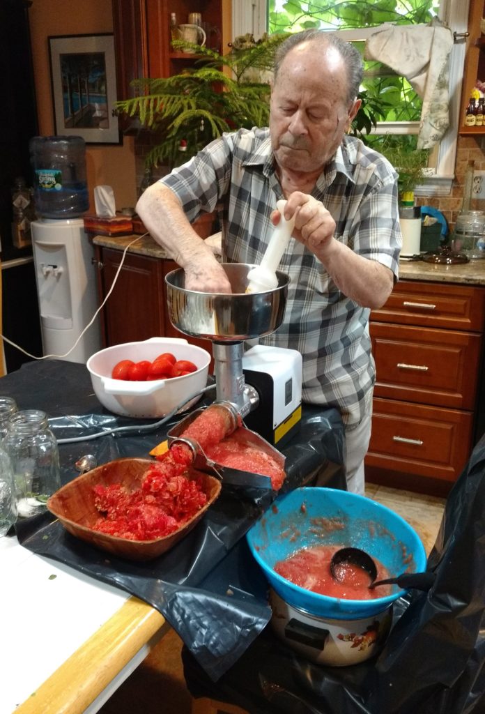 Dad grinding the tomatoes