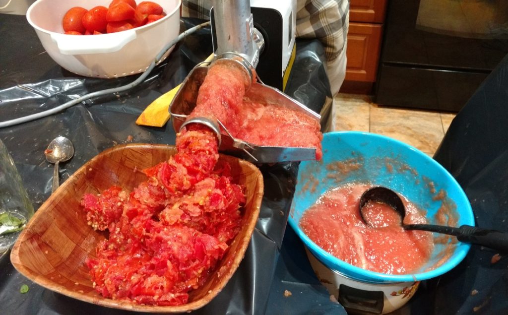 Grinding the Tomatoes for Sauce