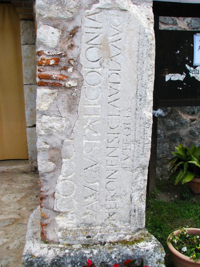 Pillar in front of the church of Santa Maria di Correanowith inscription "Augustali Colonia... Neronensis Claudia"